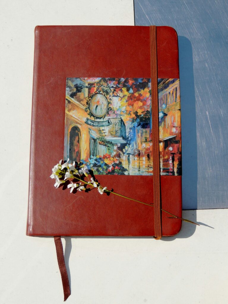 A closed notebook at the end of the day, representing the quiet satisfaction of finishing something imperfectly.